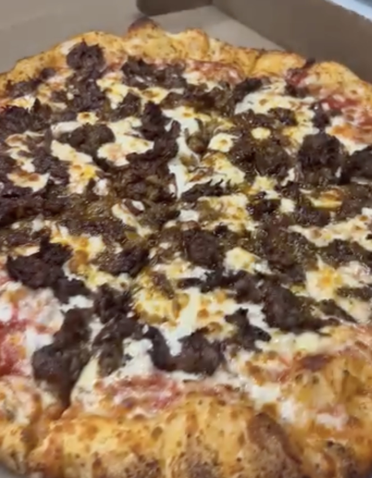 Annie's specialty pizza with seasoned beef and herbs