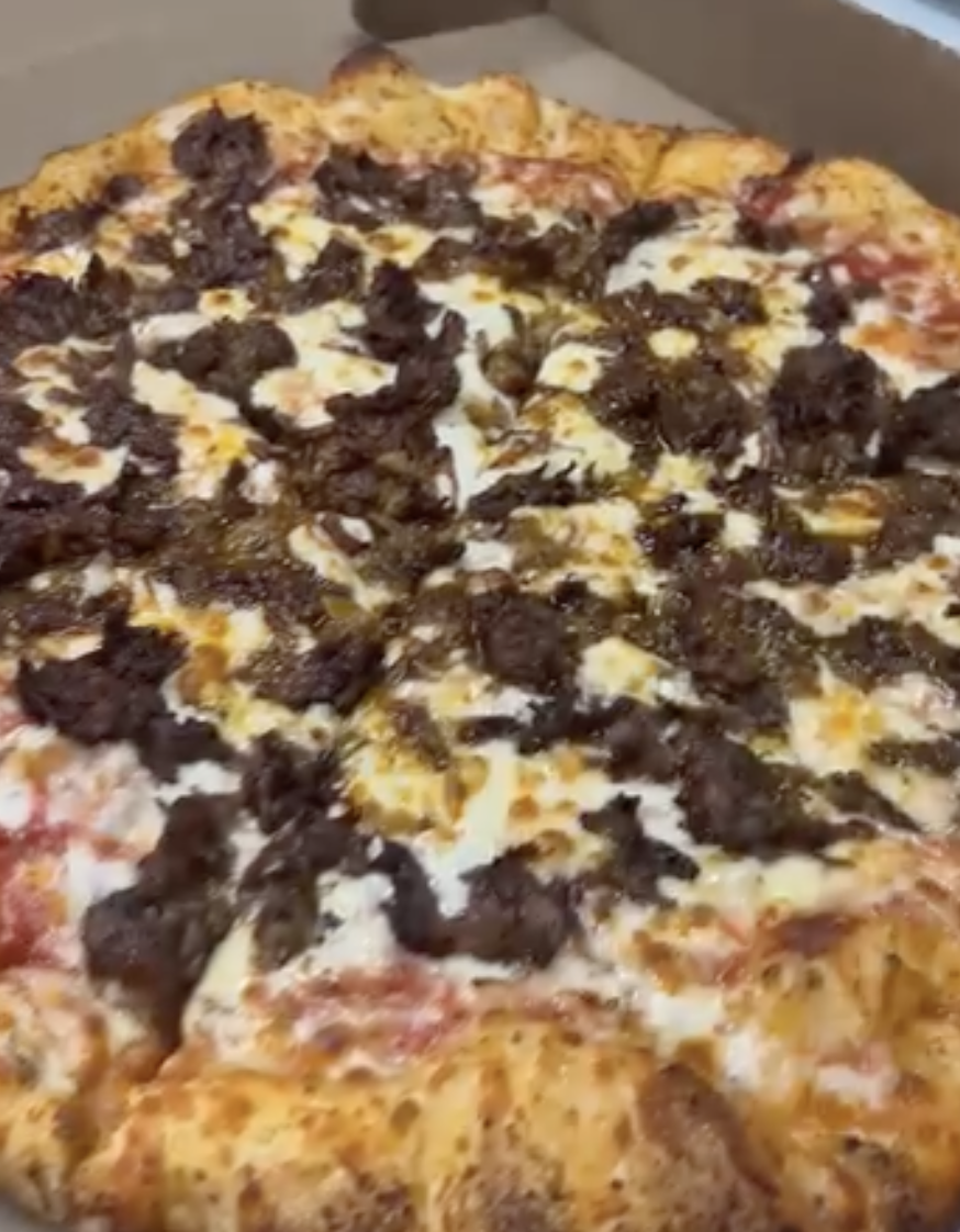 Annie's specialty pizza with seasoned beef and herbs